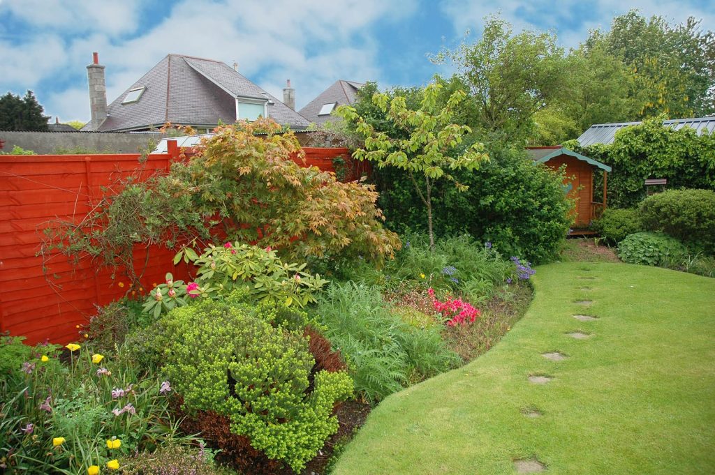 gardening shrewsbury - nice garden with flowers and green lawn
